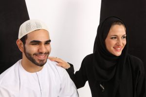 Happy Arab Couple Having A Good Time Watching A Play